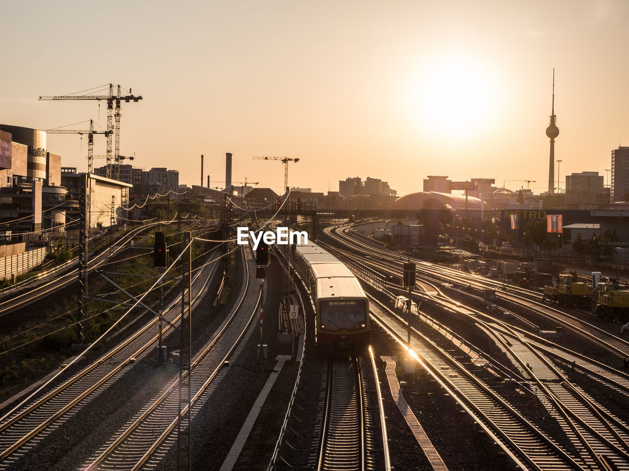 View of berlin and train tracks during golden hour