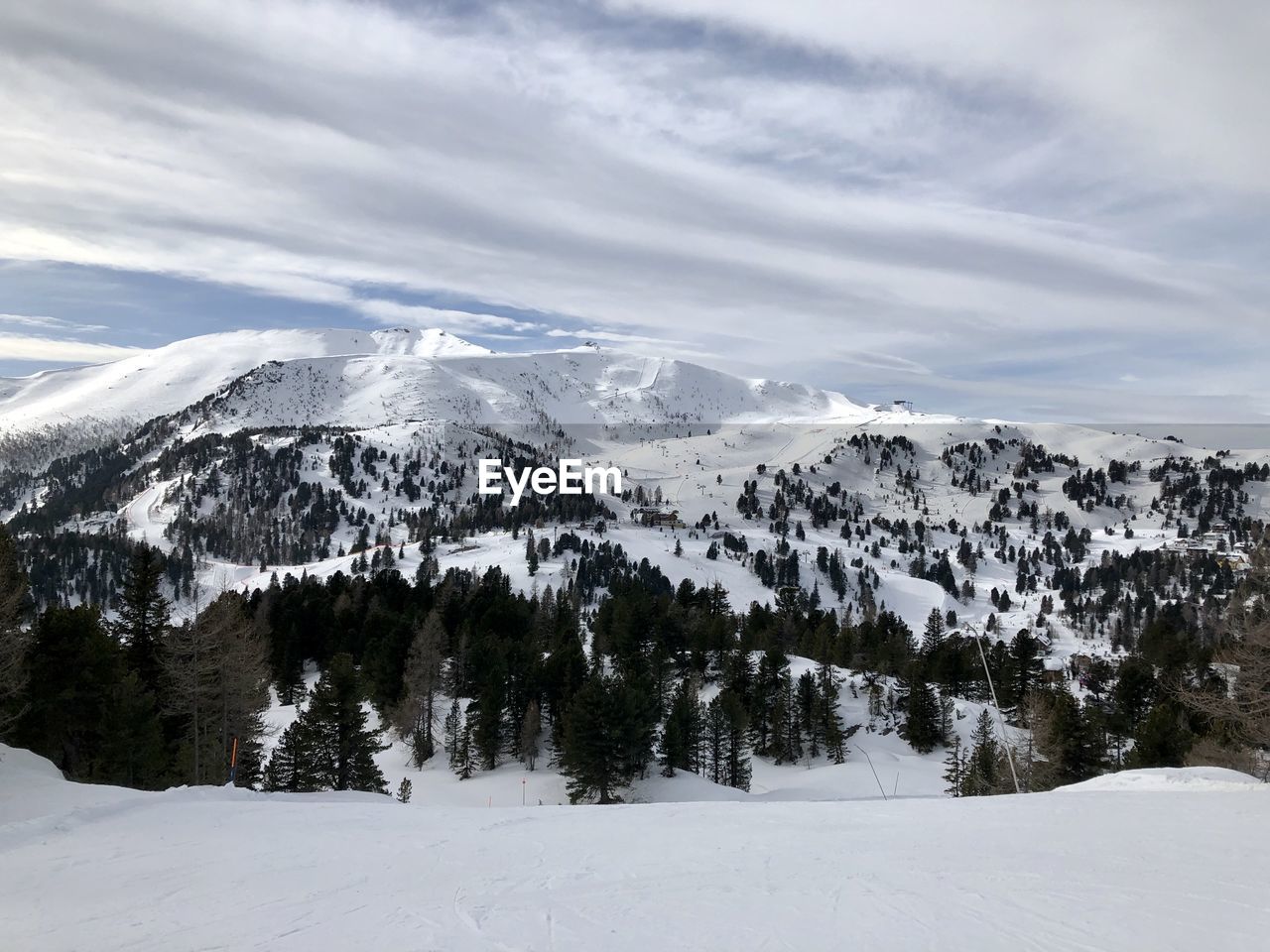 Scenic view of snow covered mountains against sky