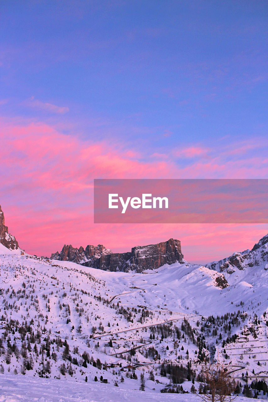 Scenic view of snowcapped mountains against sky during sunset. cortina dolomites in cadore, italy. 