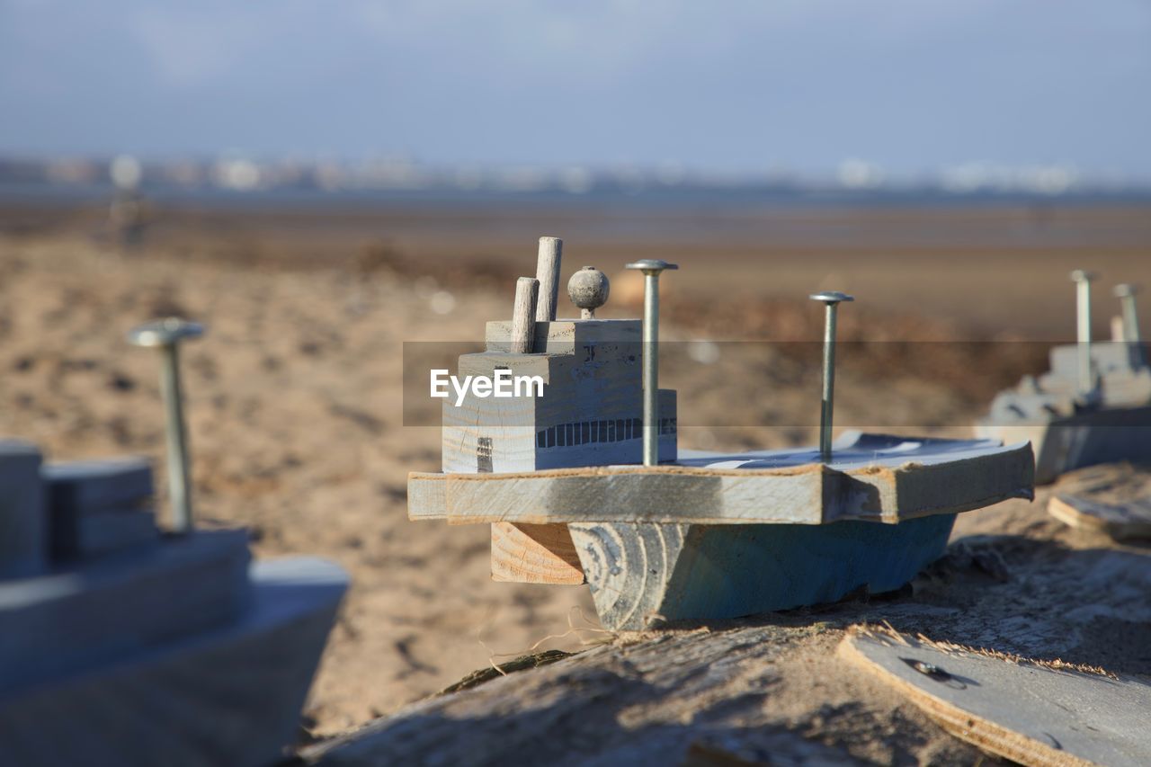 Toy wooden boats on the beach