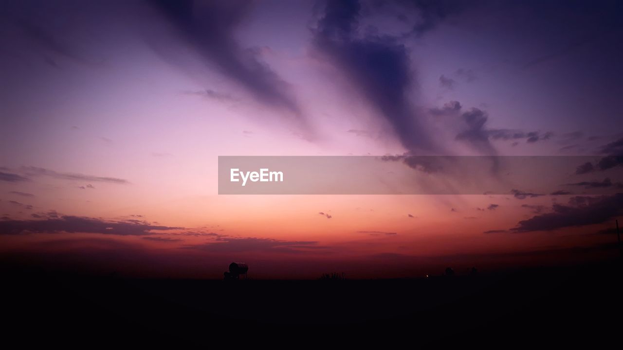 Scenic view of dramatic sky during sunset