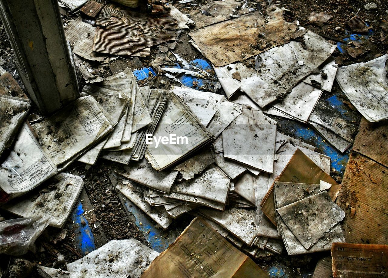 Close-up of abandoned objects on ground
