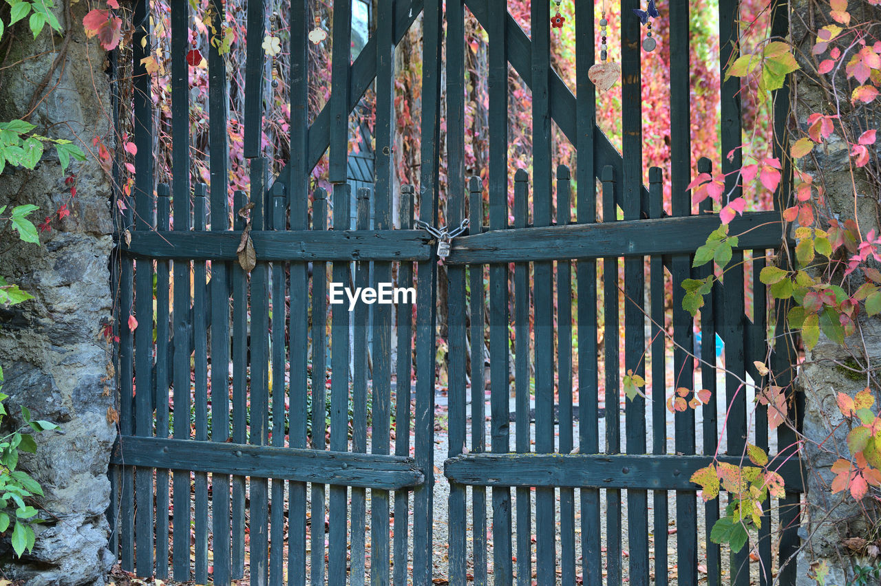 CLOSE-UP OF METAL GATE AGAINST WALL