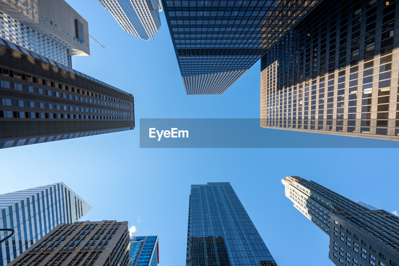LOW ANGLE VIEW OF MODERN BUILDINGS AGAINST SKY