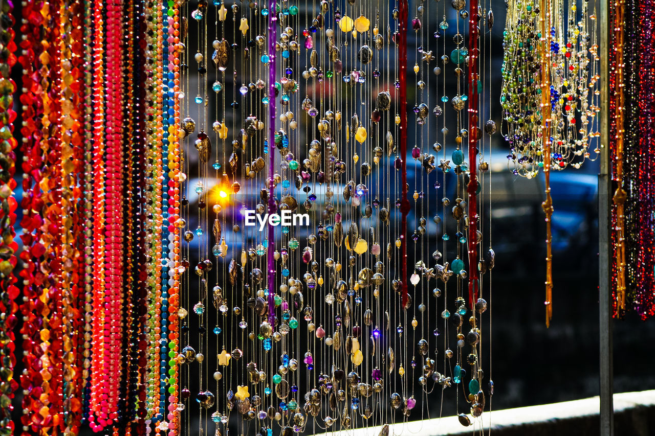 Close-up of multi colored decoration for sale at market stall