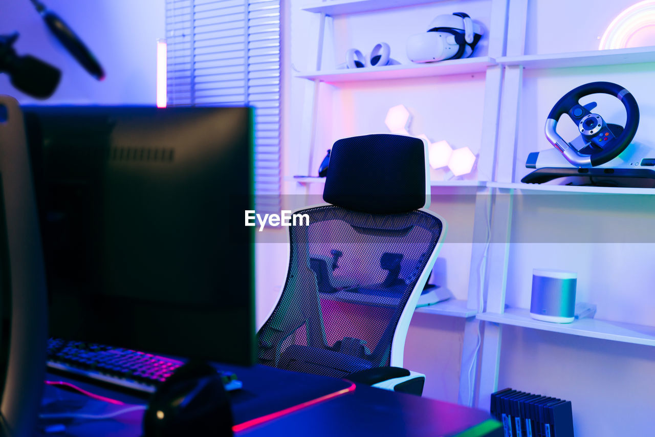 rear view of woman using laptop on table