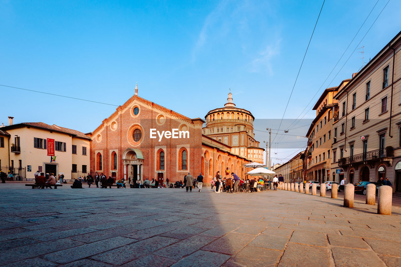 Wide angle view of the church of santa maria delle grazie, milan with people