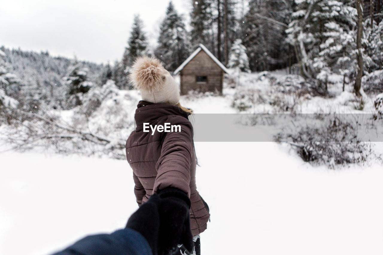 Rear view of girl in snow