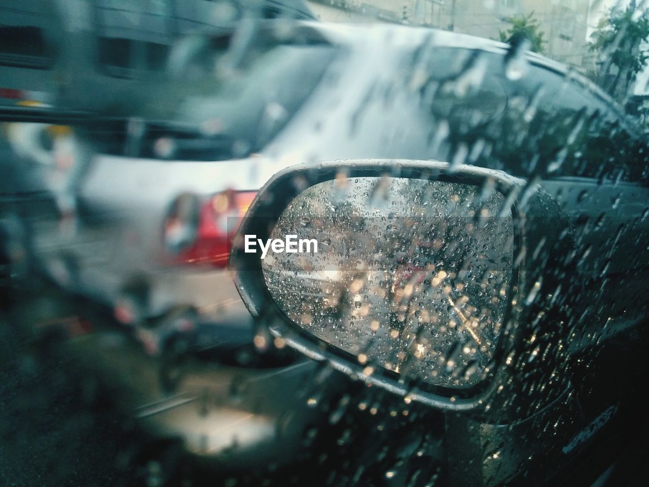 Close-up of wet car during rainy season