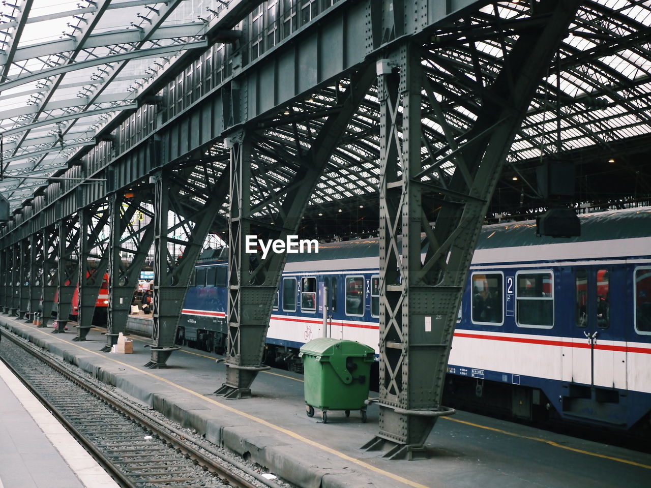 Train at railroad station platform against sky