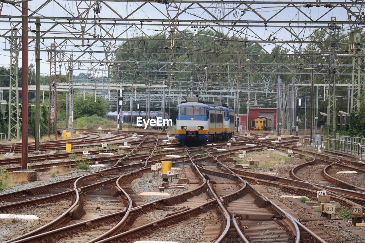 TRAIN BY RAILROAD TRACKS