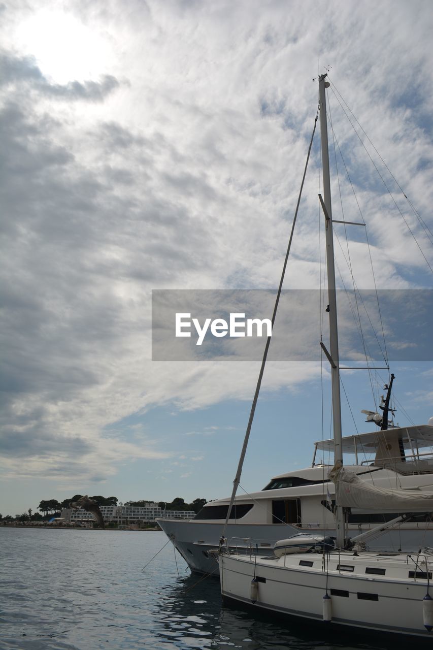 Boats moored at harbor