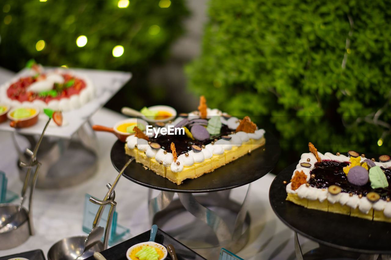 food and drink, food, dessert, sweet food, sweet, cake, freshness, baked, fruit, meal, fast food, table, no people, celebration, brunch, plate, focus on foreground, healthy eating, temptation, summer, event, party, buffet, outdoors, nature
