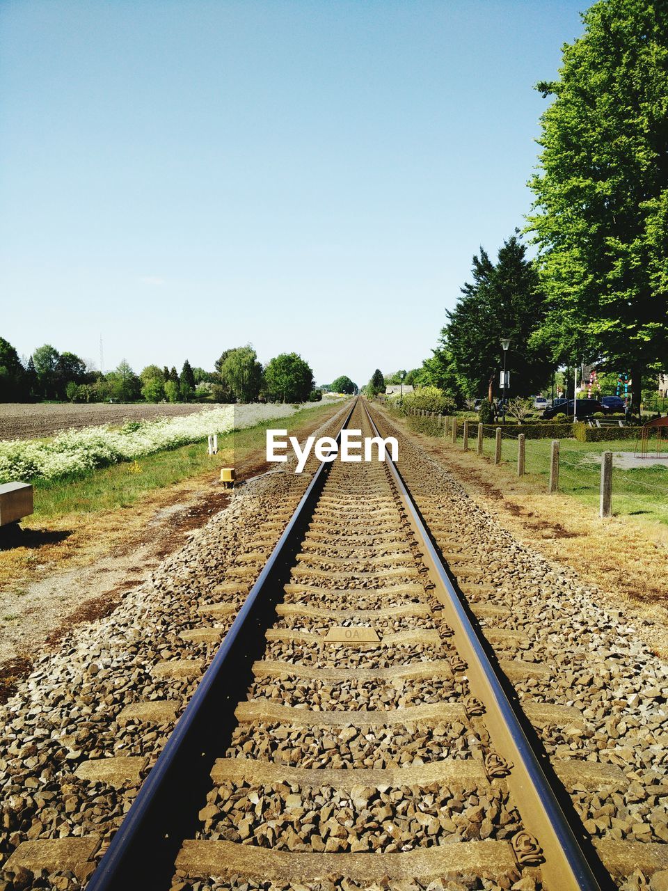 Railroad track against clear sky