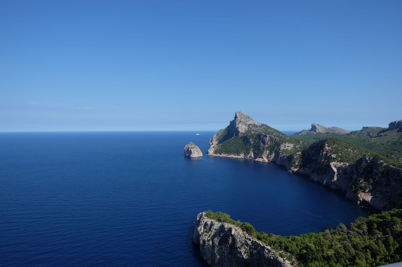 Scenic view of sea against clear blue sky