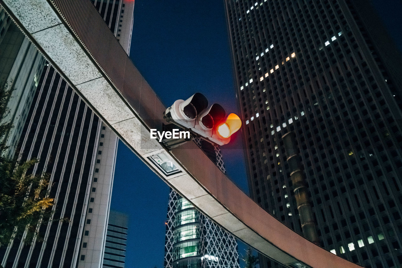 Low angle view of illuminated buildings against sky