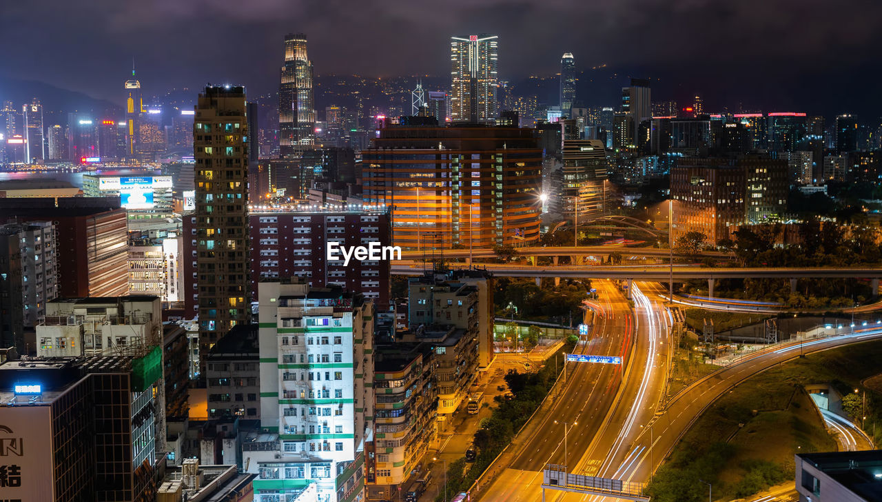High angle top view of illuminated city buildings at night,hong kong