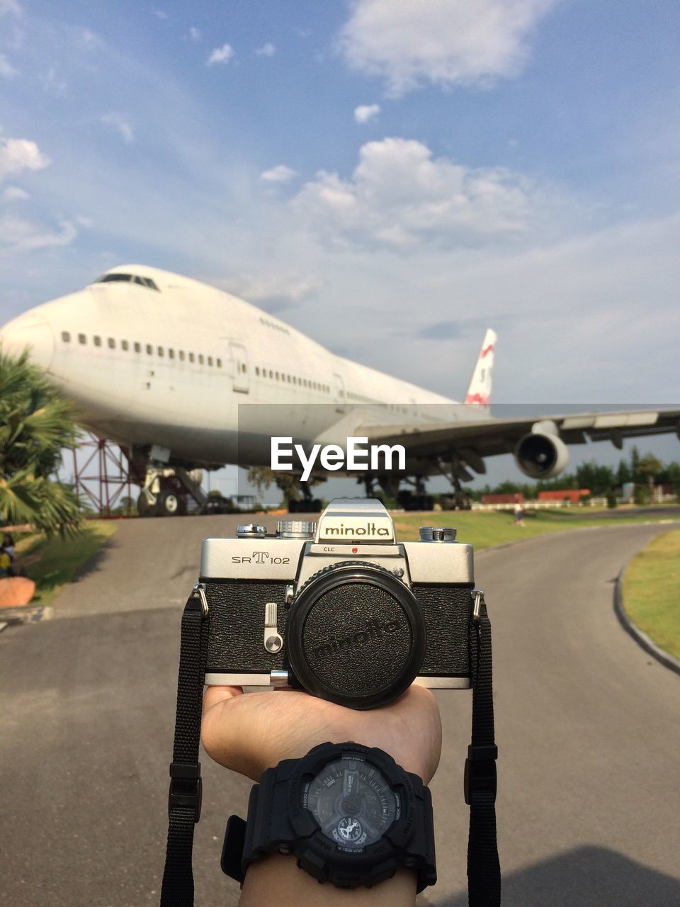 MAN AND AIRPLANE AT AIRPORT