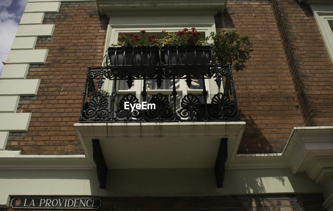 LOW ANGLE VIEW OF BRICK BUILDING