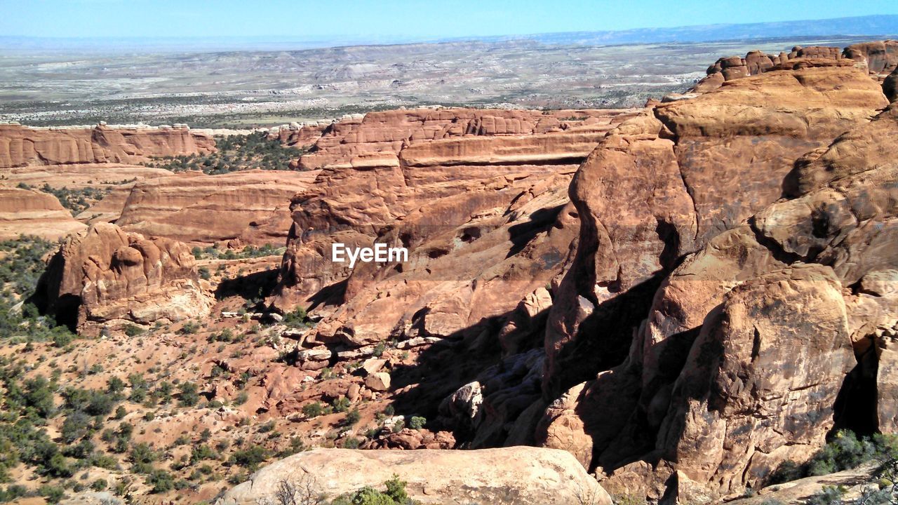 Scenic view of rocky mountains against clear sky