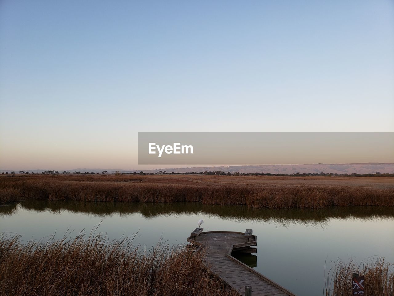 Scenic view of lake against clear sky