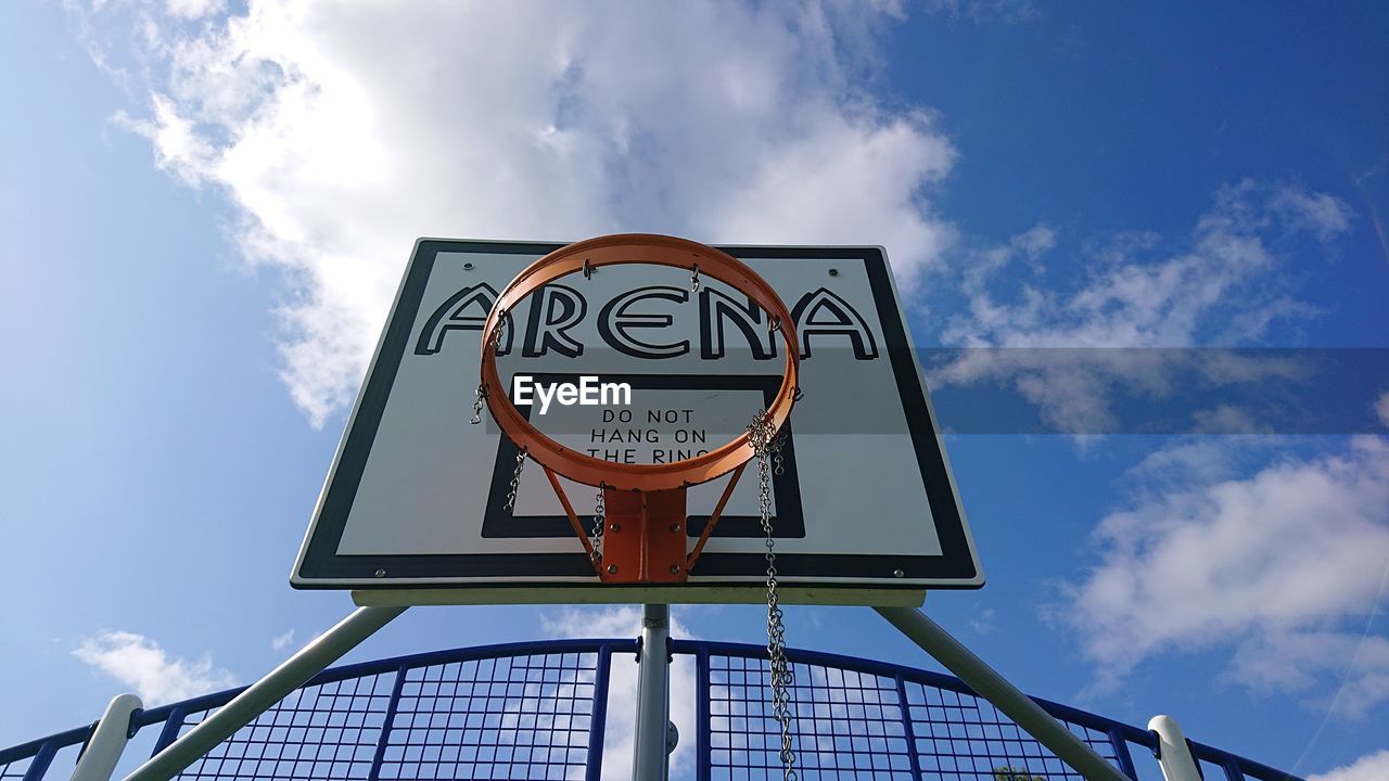 LOW ANGLE VIEW OF BASKETBALL AGAINST SKY