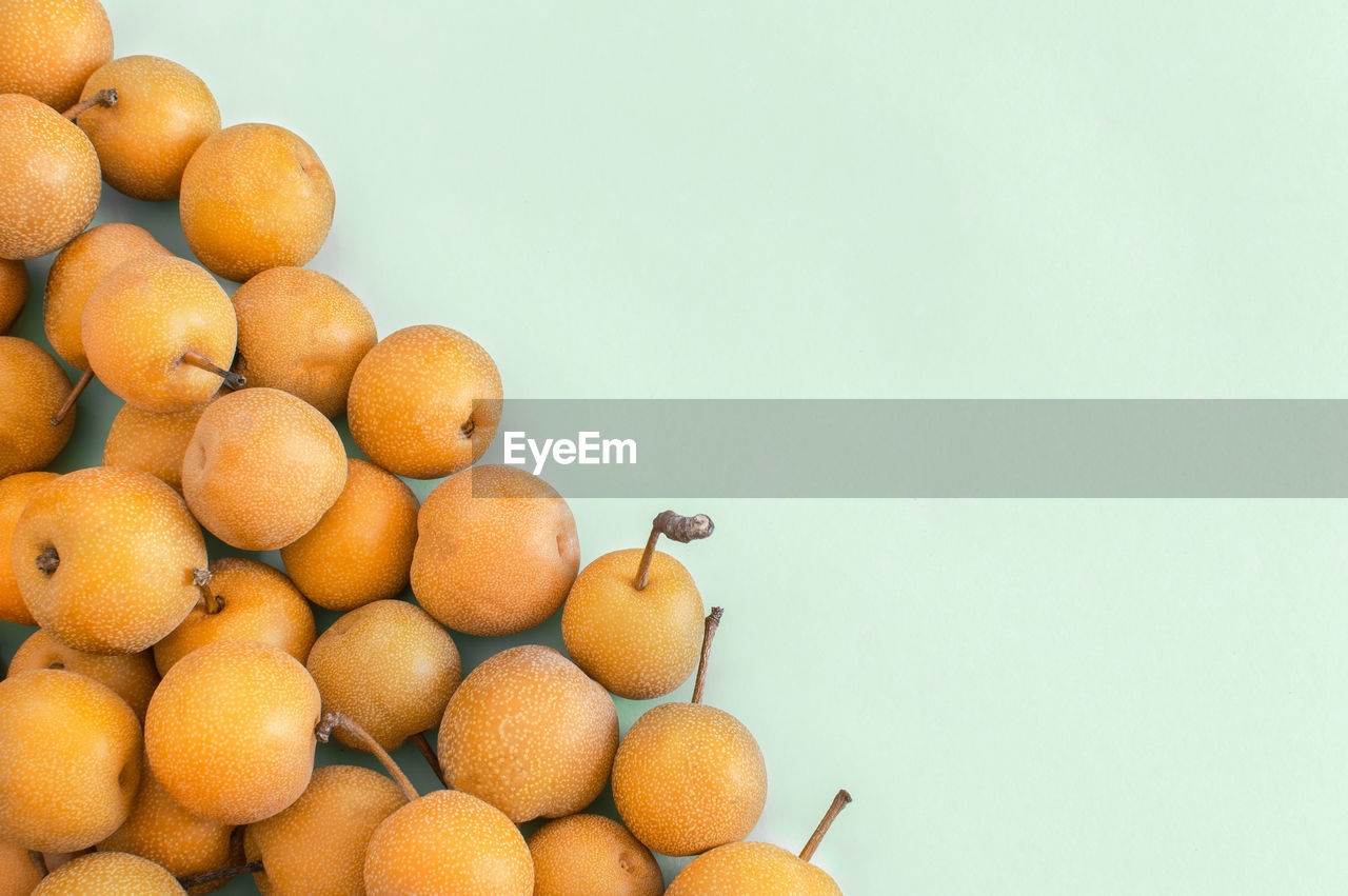 CLOSE-UP OF FRUITS IN CONTAINER