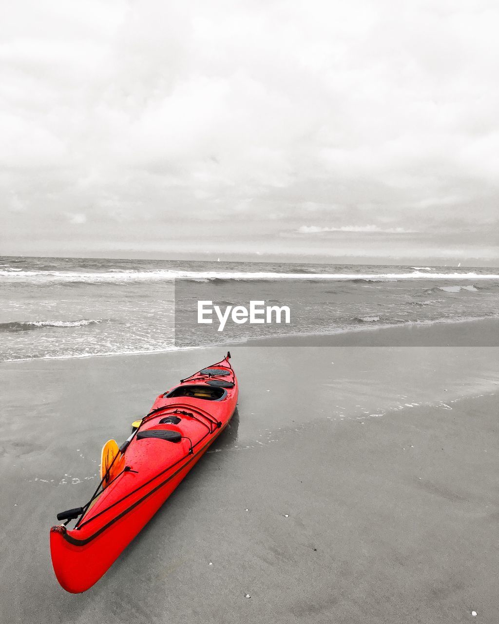 High angle view of kayak moored at sea shore against sky