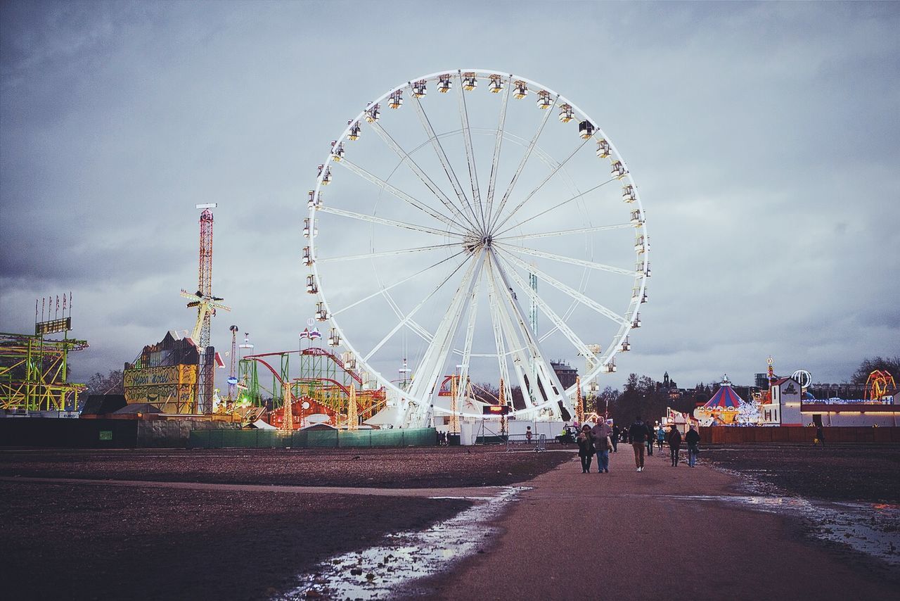 People walking towards amusement park