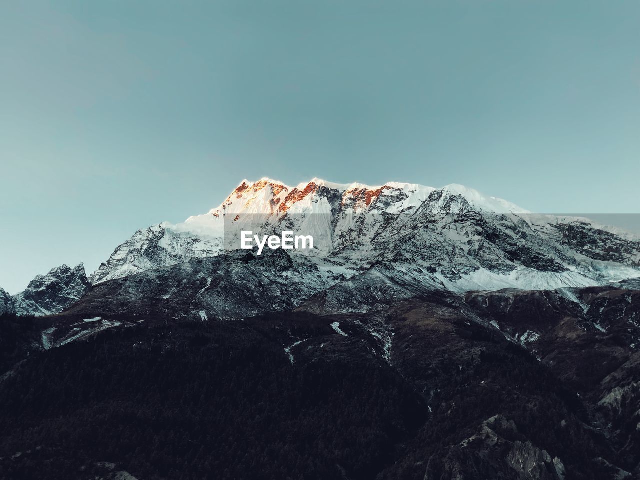 Snowcapped mountain against clear sky