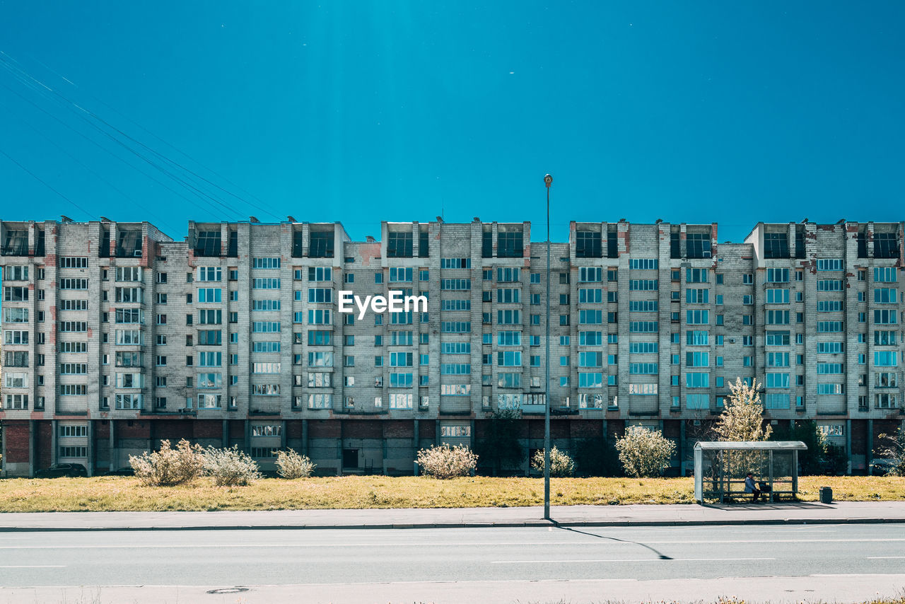 Buildings against clear blue sky