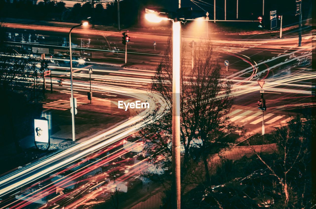 High angle view of light trails on road at night