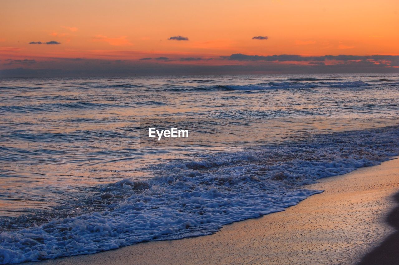 Scenic view of sea against sky during sunset