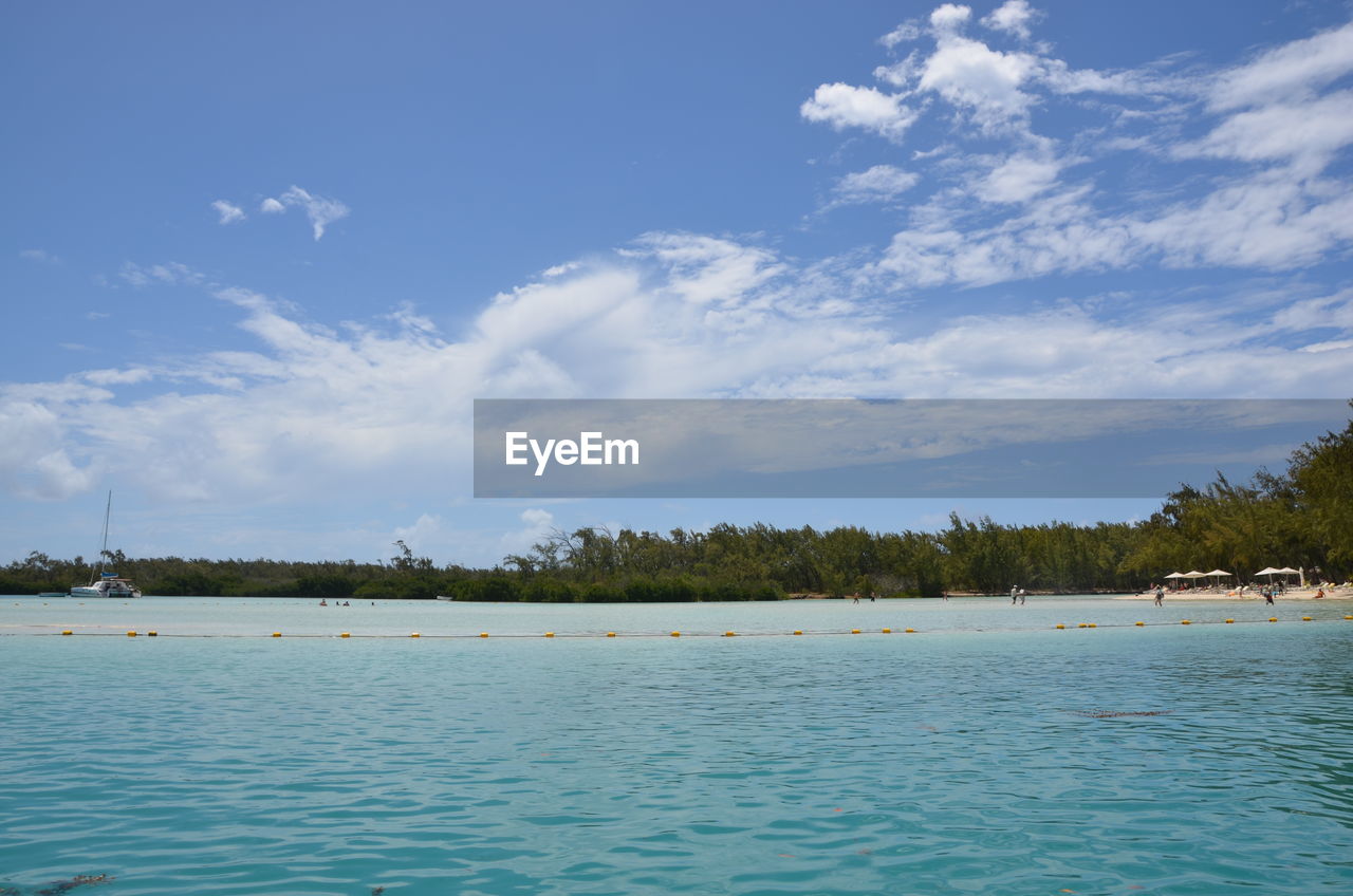 PANORAMIC VIEW OF SWIMMING POOL AGAINST SKY