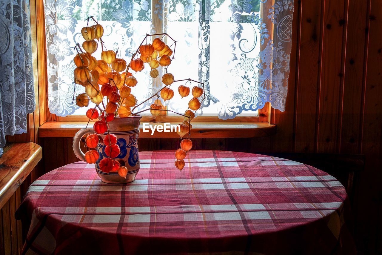 Close-up of vase on table at home