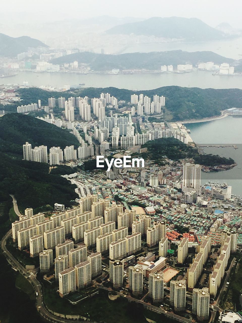 High angle view of buildings in city against sky