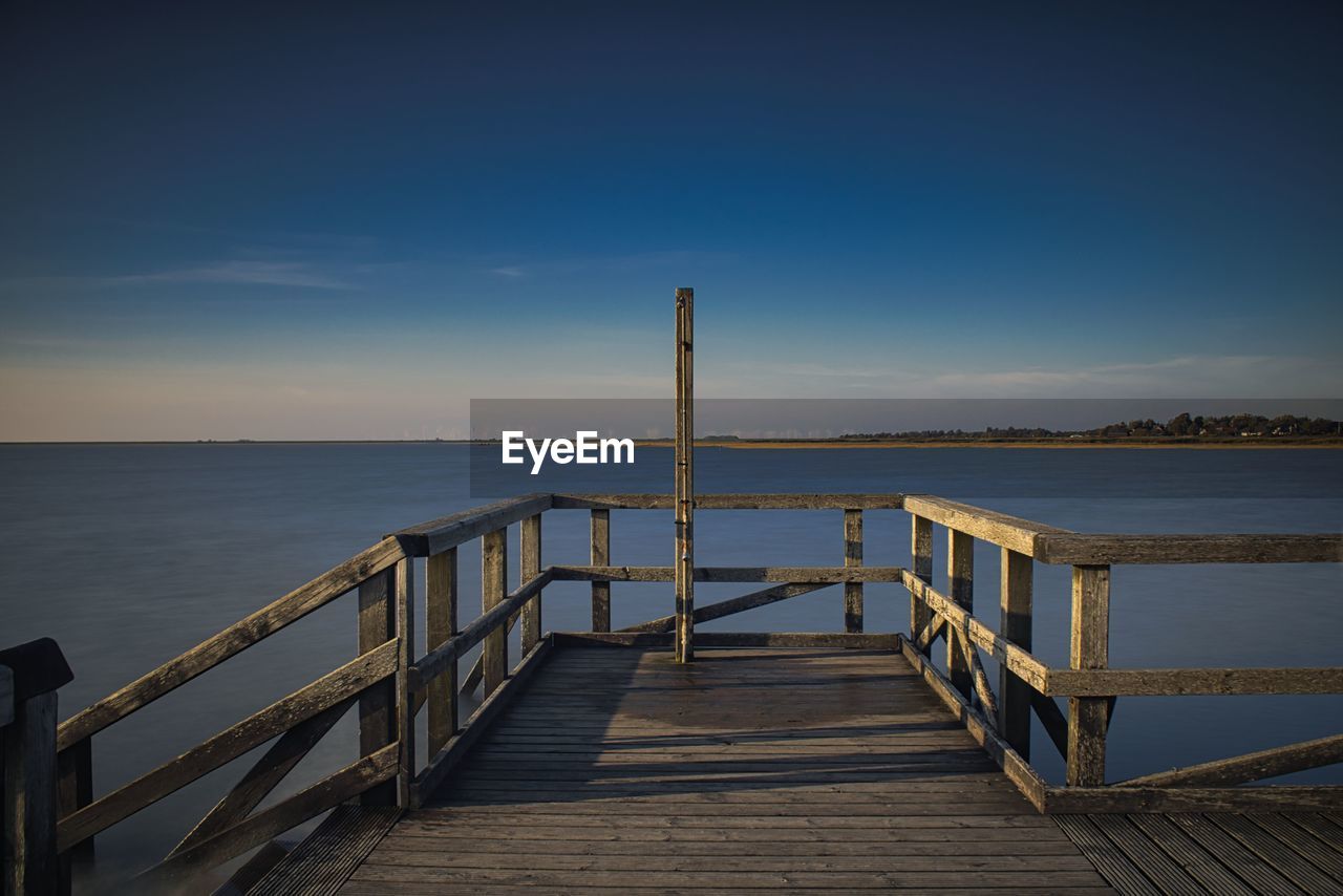 PIER ON SEA AGAINST SKY