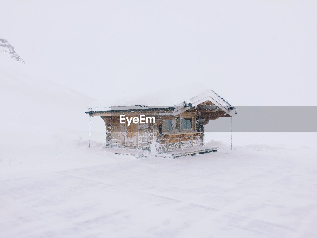 House on snow covered field