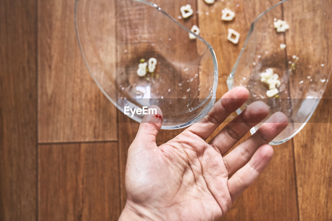 cropped hand of person holding crystal ball