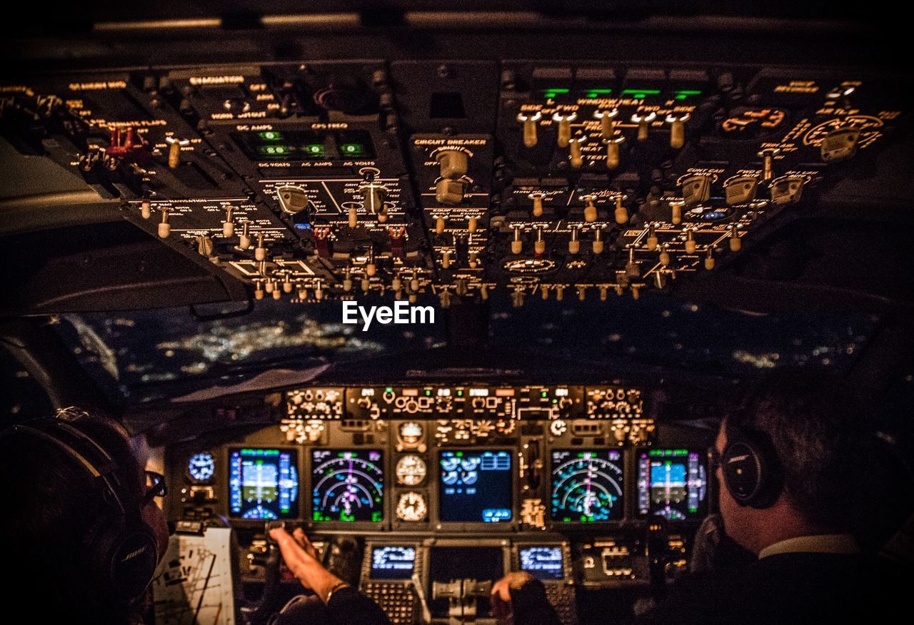 Pilot and co-pilot in airplane cockpit