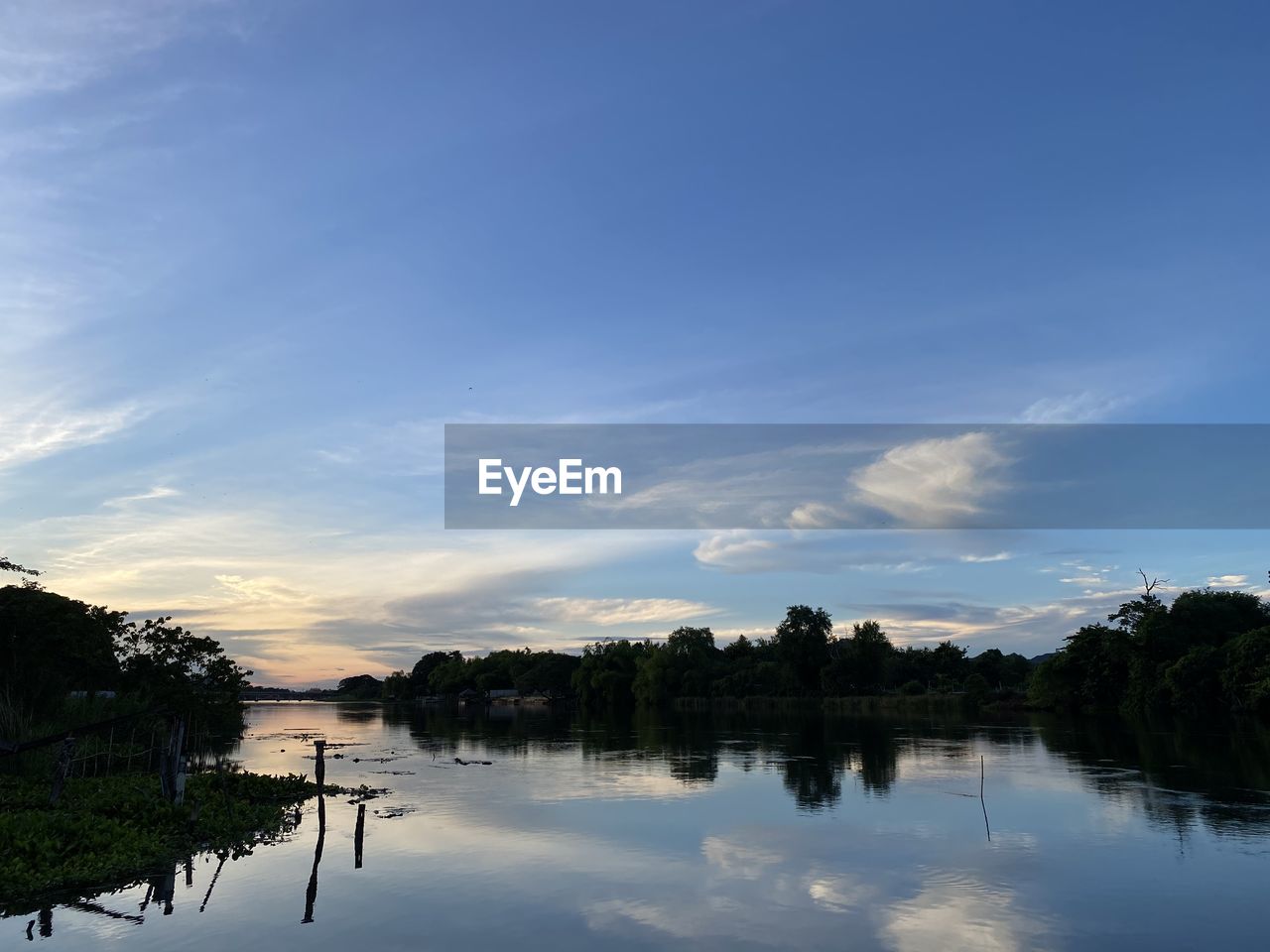 SCENIC VIEW OF LAKE AGAINST BLUE SKY