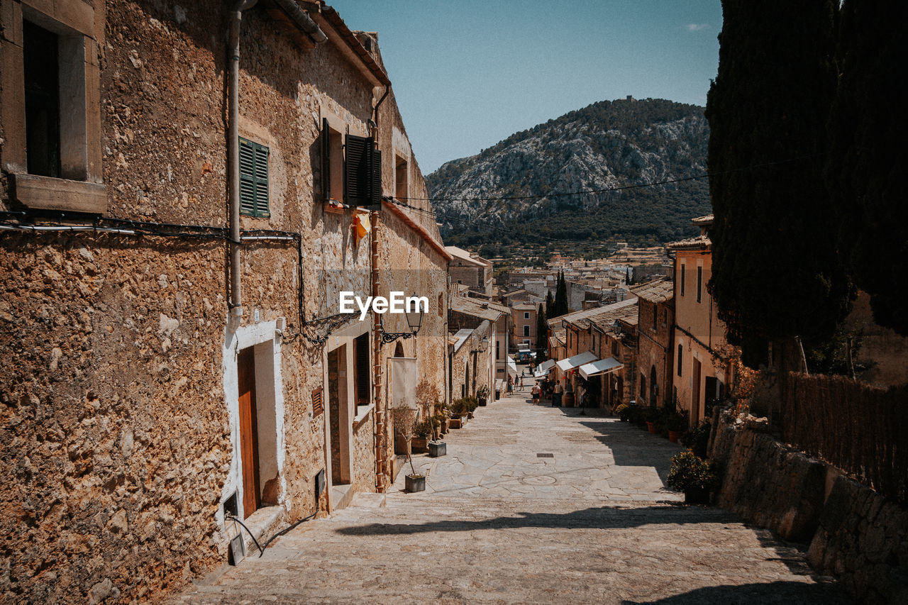 Narrow alley amidst buildings in town