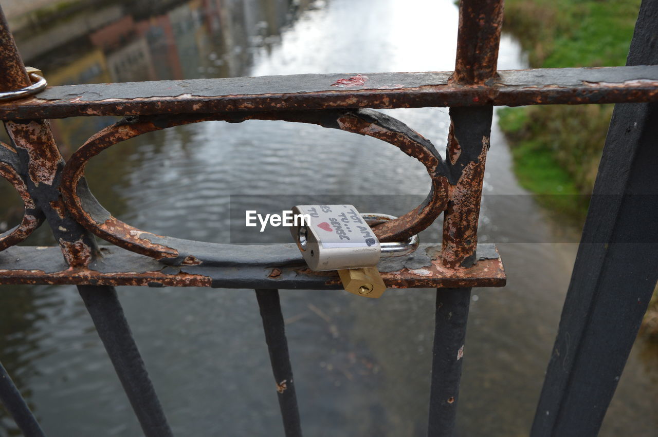 Close-up of padlock on railing