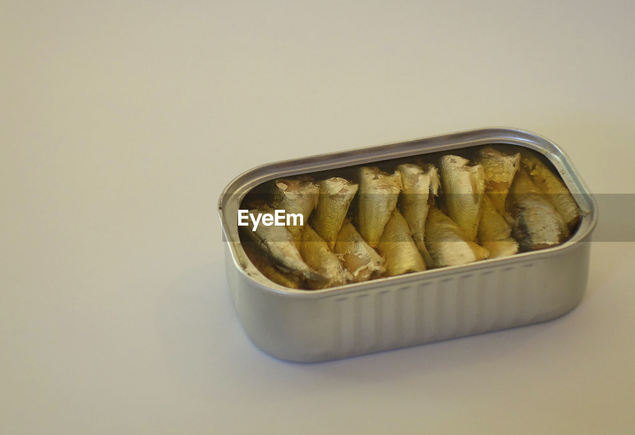 High angle view of canned food over white background