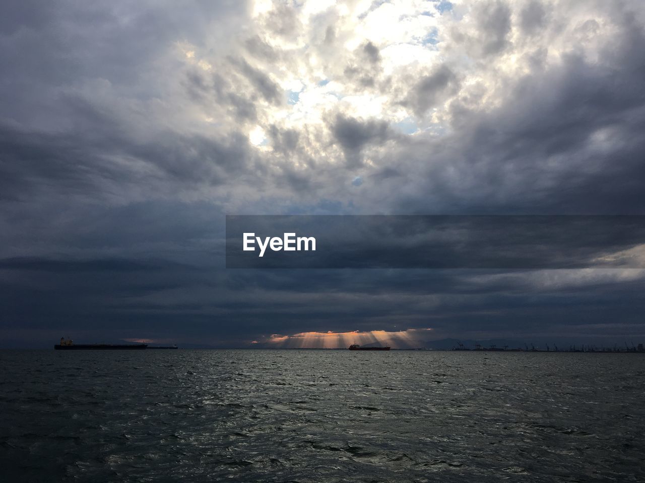 Scenic view of sea against dramatic sky