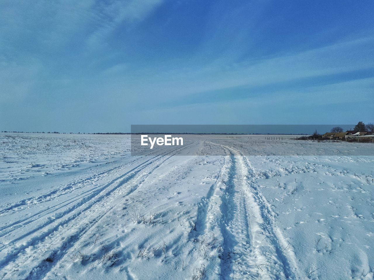 SNOW COVERED LANDSCAPE AGAINST SKY