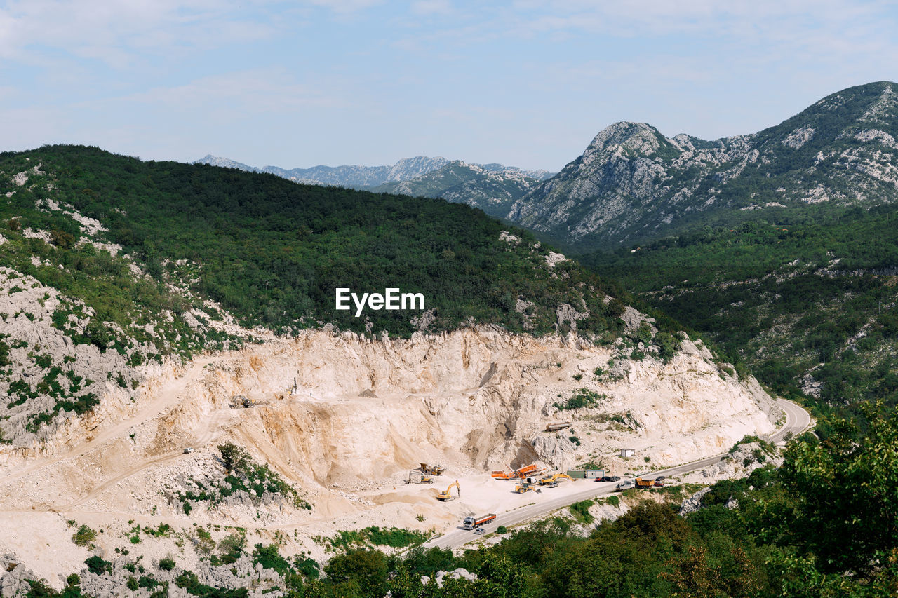 HIGH ANGLE VIEW OF IDYLLIC SHOT OF LAND AGAINST SKY