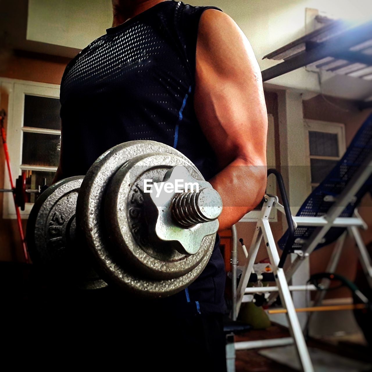 MIDSECTION OF MAN WORKING AT NIGHTCLUB