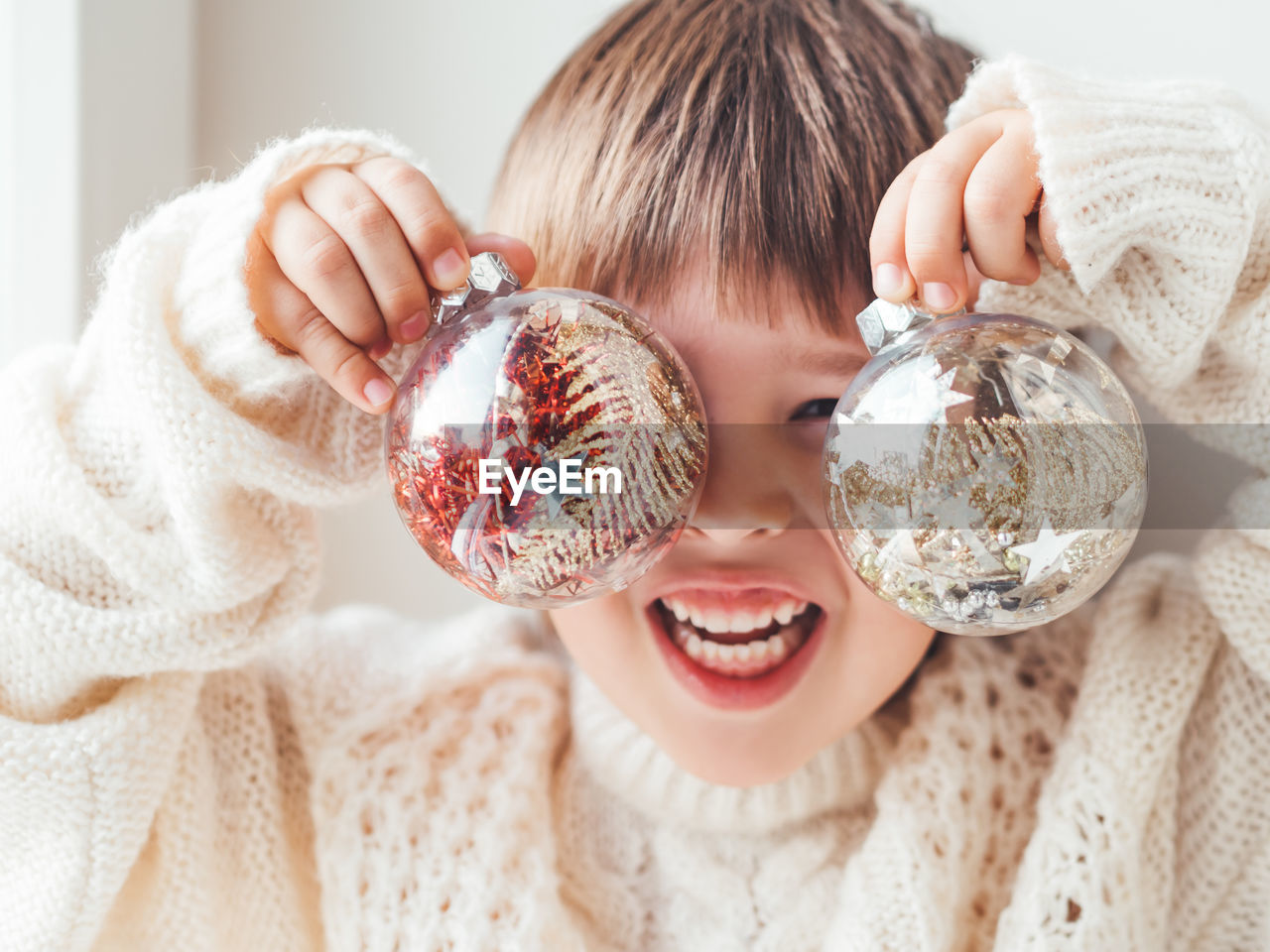 Close-up of woman holding christmas decoration