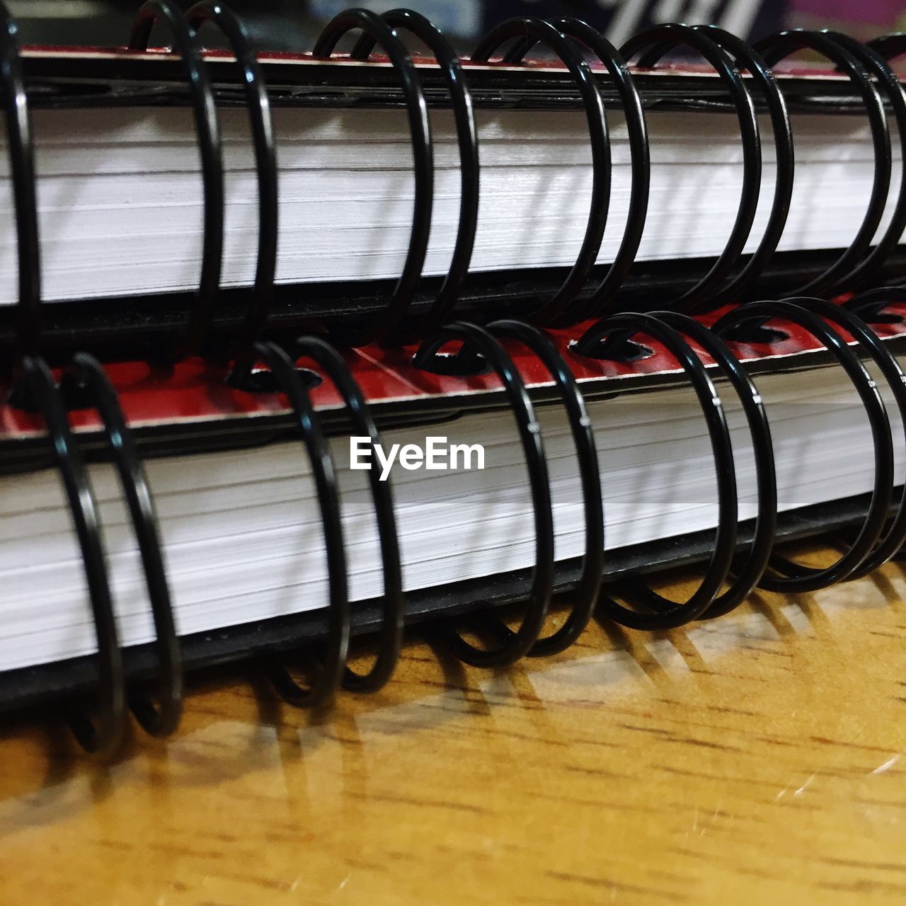 Close-up of spiral books on wooden table